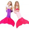 girls using the fleece mermaid tail blanket in pink and purple