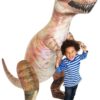 kid holding giant inflatable t-rex