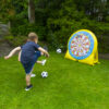 Kickball Football child playing with the football dartboard game in the garden